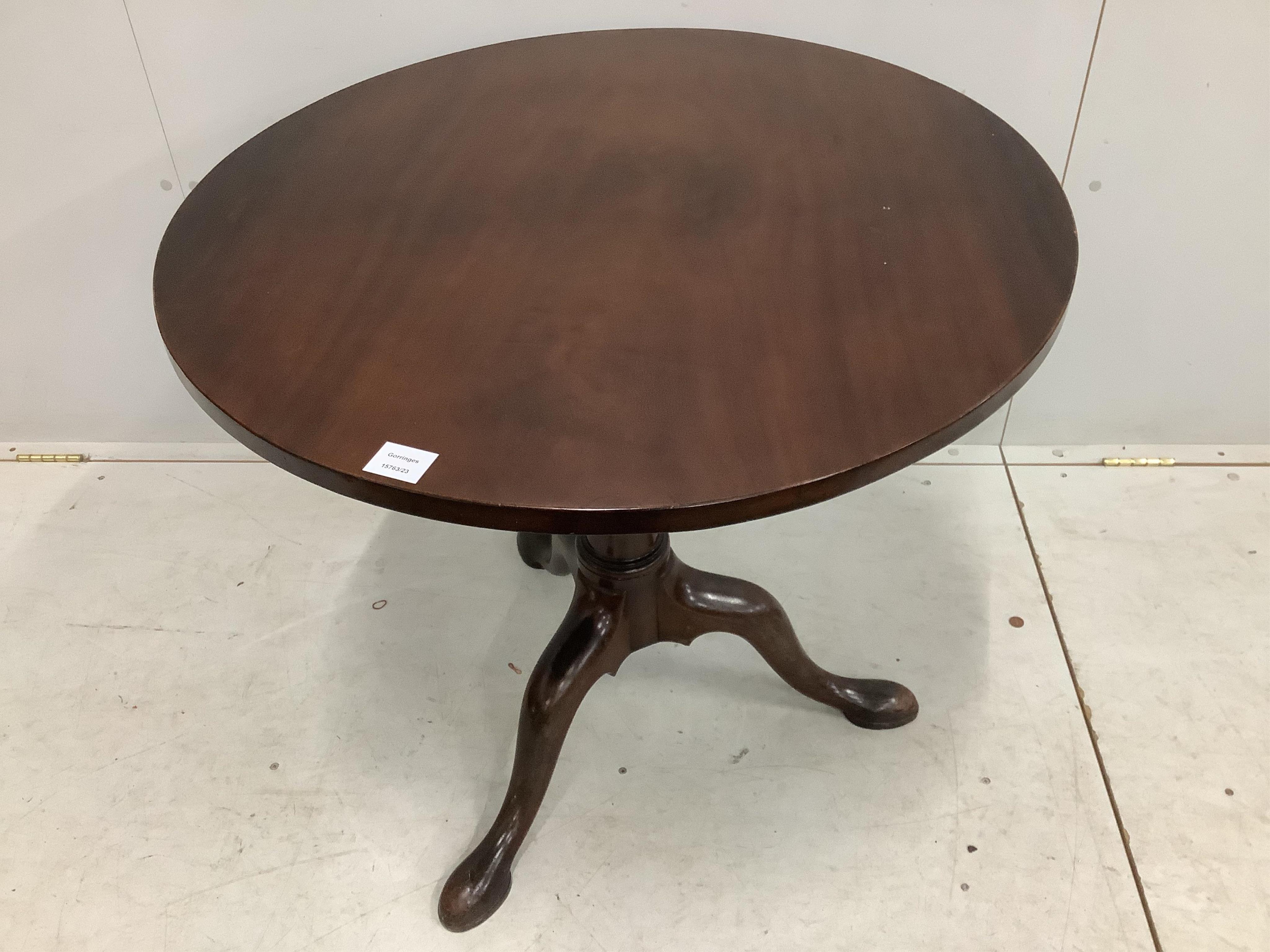 A George III circular mahogany tilt top tea table, diameter 81cm, height 71cm. Condition - fair to good